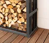 A firewood rack filled with logs, placed on a wooden deck next to a white wall. Podgląd zdjęcia produktu