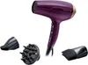 A purple Remington hair dryer with three attachments on a white background. Podgląd zdjęcia produktu