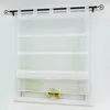 A white sheer Roman blind hangs in front of a window, with a small pot of sunflowers on the windowsill below. Produktbild-Vorschau