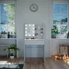 A vanity table with LED lights is set up in a room with large windows showing a winter landscape. Podgląd zdjęcia produktu