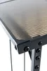A close-up view of the corner of a table or stand, showing the black metal frame and the ribbed, translucent top. Produktbild-Vorschau