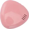 A pink, triangular-shaped object with rounded corners, possibly a toothbrush sanitizer case, is shown from a diagonal top-down view against a white background. It has a glossy finish and a few small, parallel vents on one side. Náhľad obrázku produktu