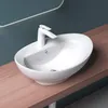 A white ceramic sink with a modern white faucet sits on a wooden countertop. Produktbild-Vorschau