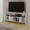 A white corner TV stand with a TV and various items on it, placed in a room. Produktbild-Vorschau