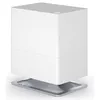 A white humidifier with a silver base, shown against a white background. Podgląd zdjęcia produktu