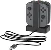 A charging dock for Nintendo Switch Joy-Con controllers is shown on a white background. Anteprima dell’immagine prodotto