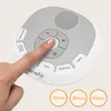 A finger is pressing a button on a white and gray baby sleep aid device. The device has various buttons and a speaker grill. Three circular icons with timers are visible at the bottom. Náhľad obrázku produktu