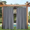 Outdoor curtains hanging from a wooden pergola, with a stone building and pool in the background. Produktbild-Vorschau
