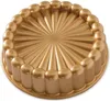 A gold-colored cake pan with a fluted design. Produktbild-Vorschau