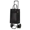 A black shopping trolley with a leather front pocket and adjustable handle, shown against a white background. Podgląd zdjęcia produktu