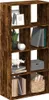 A tall, narrow bookshelf with eight cube-shaped compartments, filled with various decorative items and books. Náhled obrázku produktu