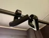 A close-up view of a black pull-up bar grip attached to a bar. Náhľad obrázku produktu