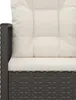 Close-up view of a black rattan garden chair with cream cushions. Voir les images du produit
