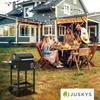 A group of people are having a barbecue in a backyard. Náhľad obrázku produktu
