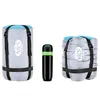Three camping items are displayed against a white background. On the left is a gray sleeping bag in a compression sack, with blue trim and black straps. In the center is a black water bottle with a green band. On the right is another gray sleeping bag in a Náhľad obrázku produktu