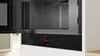 The image shows the interior and control panel of a built-in Bosch microwave oven. Voir les images du produit
