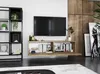 A modern living room setup with a wall-mounted TV and entertainment unit. Produktbild-Vorschau