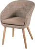 A single wicker chair with a tan cushion on a white background. Produktbild-Vorschau