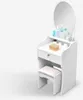 A white vanity table with a mirror and a stool, set against a white background. Voir les images du produit