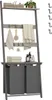 A ladder-style shelf unit with laundry baskets at the bottom, displayed in a bathroom or laundry room setting. Produktbild-Vorschau
