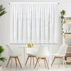 A white sheer curtain hangs over a window, with a dining table and chairs in the foreground. Produktbild-Vorschau