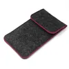 A dark gray felt pouch with pink trim is shown against a white background. Produktbild-Vorschau