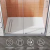 Interior of a modern shower stall with glass doors and tiled walls. Podgląd zdjęcia produktu