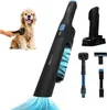 A cordless vacuum cleaner and its accessories are displayed against a white background, with a dog being groomed in the background. Náhled obrázku produktu