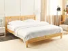A wooden bed frame with white bedding is shown in a bedroom setting. Produktbild-Vorschau