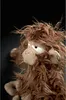 Close-up of a stuffed monkey toy with messy brown fur. Náhled obrázku produktu