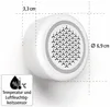 A white, round device with a patterned grille on the front, shown with measurement lines and text indicating its dimensions and function. Produktbild-Vorschau