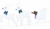 Three white LED reindeer and a sleigh decorated with bows and holly for Christmas. Podgląd zdjęcia produktu