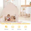 A young girl is reading a book inside a beige play tent, surrounded by stuffed animals. A wooden crib is visible in the background. Produktbild-Vorschau