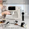 A person is operating a coffee machine, with various coffee-making accessories displayed in the foreground. Voir les images du produit