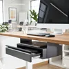 A close-up view of a desk with a computer monitor, keyboard, mouse, and an under-desk drawer. Voir les images du produit