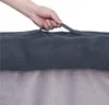 A hand is holding a handle on a dog bed. Anteprima dell’immagine prodotto