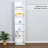 A tall, white, six-shelf bookcase is shown standing against a light gray wall, with a potted plant to its left. The bookcase is decorated with a few items on its shelves, including books, a basket of fruit, decorative objects, and a storage box. Produktbild-Vorschau
