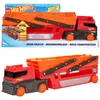 A Hot Wheels Mega Hauler truck toy is shown in its packaging and also displayed outside of the packaging. Náhled obrázku produktu