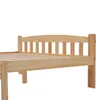 A close-up view of a wooden bed frame, showing the headboard and part of the slatted base. Produktbild-Vorschau