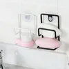 Two soap dishes mounted on a tiled wall above a sink. Produktbild-Vorschau
