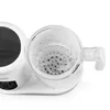 A close-up view of a white baby food maker with a clear plastic steaming basket. Produktbild-Vorschau