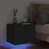 A black bedside table with LED lights is placed next to a bed in a dimly lit room. Náhľad obrázku produktu