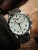 A close-up shot of a man's wrist wearing a chronograph watch. Náhled obrázku produktu