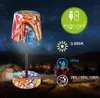 A graffiti-style LED table lamp is shown outdoors at night, with a starry sky and a distant city in the background. Tents are visible in the foreground, suggesting a camping or outdoor setting. Anteprima dell’immagine prodotto