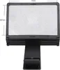 A black phone screen magnifier with a stand is shown against a white background. Náhled obrázku produktu