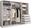 A white wardrobe with clothes and luggage inside. Produktbild-Vorschau