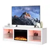 A white TV stand with an electric fireplace and LED lighting, featuring a large television on top displaying a mountain landscape. Voir les images du produit