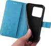 A hand is holding a blue flip phone case open, revealing the inside compartments and the phone holder. Produktbild-Vorschau