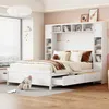 A white bed with storage drawers and a bookshelf headboard in a bedroom. Produktbild-Vorschau