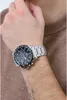 A person wearing a watch on their wrist. Produktbild-Vorschau